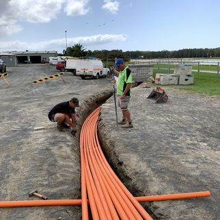 Orange conduit in trench